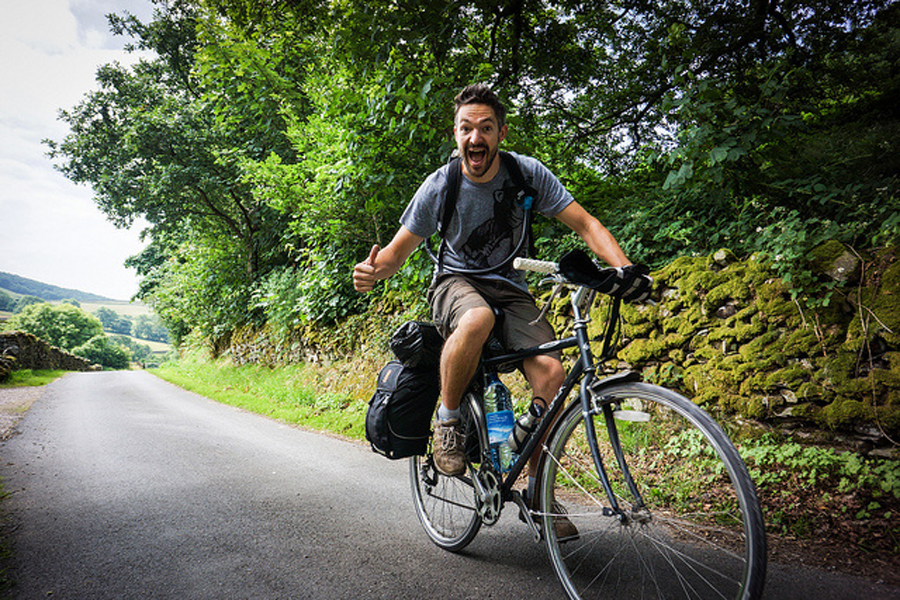 Tom Allen Riding his salvaged bike